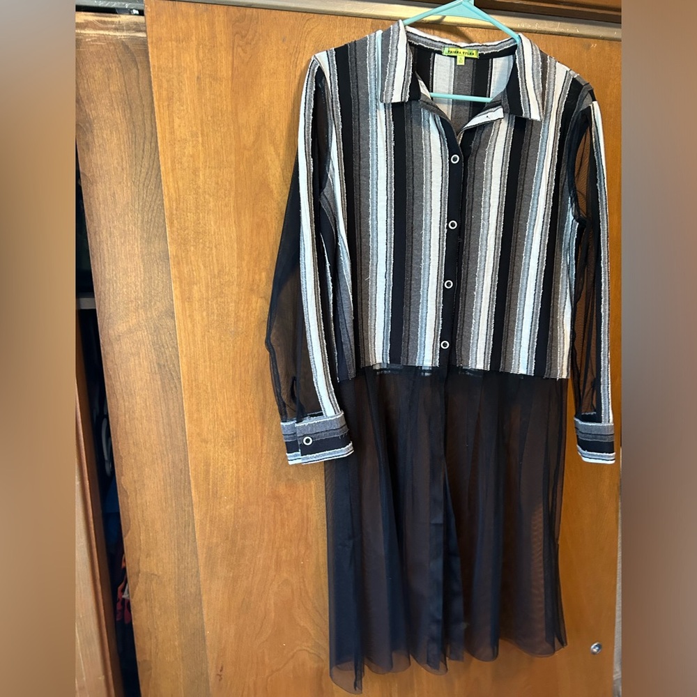 Size small blouse with mesh material. Cute with leggings! Or “leather” leggings